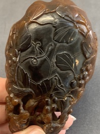 A rare Chinese carved rhinoceros horn 'libation cup' with grape design, 17/18th C.