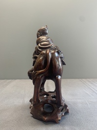 A pair of Chinese carved bamboo groups of a boy riding a buffalo, 19/20th C.