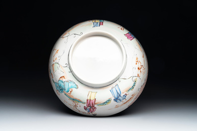 A Chinese Canton famille rose bowl with figures in a garden, Qianlong