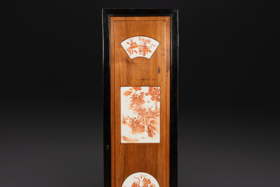A Chinese four-part folding screen with iron-red-decorated porcelain plaques, 19/20th C.