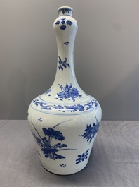 A Chinese blue and white bottle vase with floral sprigs, Transitional period