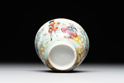 A Dutch-decorated Chinese porcelain cup and saucer with figures in a landscape, 18th C.