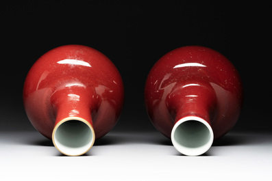 A Chinese apple-green-glazed and two copper-red-glazed bottle vases, Kangxi mark, 19/20th C.