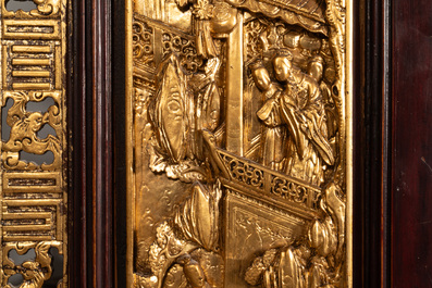 A Chinese four-part reticulated and partially gilt wooden folding screen, 19th C.