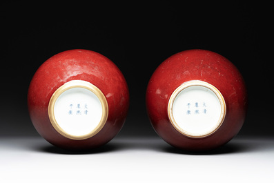 A Chinese apple-green-glazed and two copper-red-glazed bottle vases, Kangxi mark, 19/20th C.