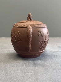 A Chinese Yixing stoneware teapot with relief design, Kangxi