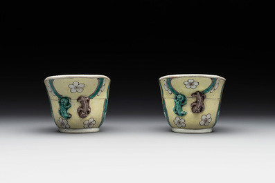 A pair of fine Chinese sancai-glazed 'Buddhist lion and chilong' libation cups, Kangxi