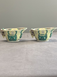 A pair of fine Chinese sancai-glazed 'Buddhist lion and chilong' libation cups, Kangxi
