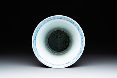 A Chinese blue and white 'gu' vase with a lady and antiquities, Kangxi