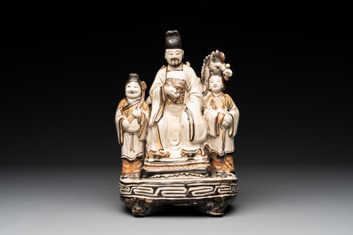 A rare Chinese Cizhou group with a dignitary, two attendants and a horse, Ming