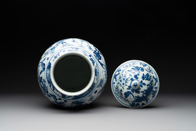 A pair of Chinese blue and white vases and covers with figural panels, 19th C.
