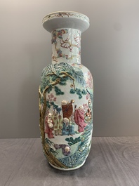 A pair of Chinese famille rose '18 luohan' vases with relief design, 19th C.