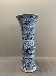 A Chinese blue and white 'landscape' 'gu' vase, Kangxi