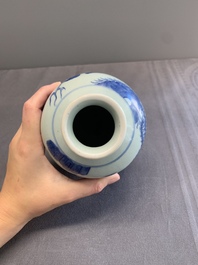A Chinese blue, white and copper-red 'kylin and phoenix' vase, 19th C.