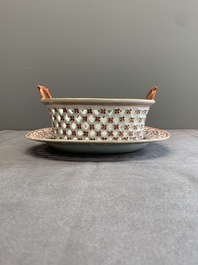 A Chinese openworked famille rose 'antiquities' basket and stand, Qianlong