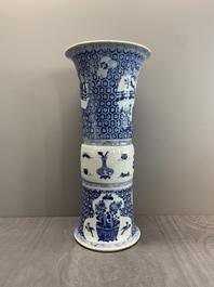 A Chinese blue and white 'gu' vase with a lady and antiquities, Kangxi