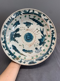 Two Chinese Swatow red-, turquoise- and black-enamelled 'phoenixes' and 'river landscape' dishes, Ming