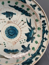 Two Chinese Swatow red-, turquoise- and black-enamelled 'phoenixes' and 'river landscape' dishes, Ming