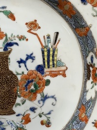 A Chinese famille rose 'antiquities' dish and two plates, Yongzheng/Qianlong