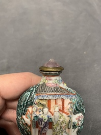 A Chinese famille rose relief-molded snuff bottle with an animated river landscape, Jiaqing mark and of the period