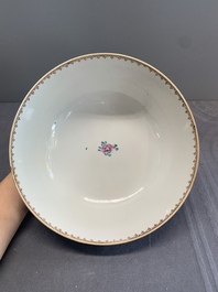 A Chinese Canton famille rose bowl with figures in a garden, Qianlong