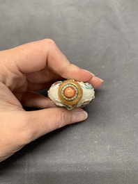 A Chinese molded famille rose 'antiquities' snuff bottle and porcelain stopper, Qianlong mark, 19th C.