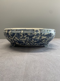 A Chinese Swatow blue and white crackle-glazed 'peonies and trigrams' tripod censer, Ming