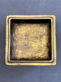 A Chinese square gilt bronze ink box and cover (印泥盒), Xuande mark and possibly of the period
