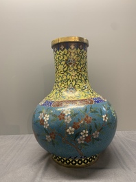 A pair of large Chinese cloisonn&eacute; 'magpies among flowering branches' vases, 19th C.