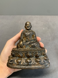 A Tibetan bronze Padmasambhava, 14th C.