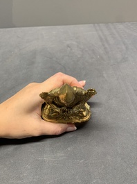 A Sino-Tibetan gilt bronze figure of a lama, 18/19th C.