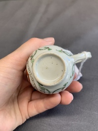 A fine Chinese famille rose armorial cup and two saucers, Yongzheng/Qianlong