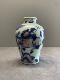 A Chinese blue, white and copper-red 'kylin and phoenix' vase, 19th C.