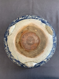 A Chinese Swatow blue and white crackle-glazed 'peonies and trigrams' tripod censer, Ming