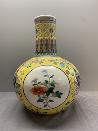 A large Chinese famille rose yellow-ground 'tianqiu ping' vase with flowers and antiquities, 19th C.