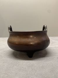 A Chinese bronze tripod censer, Xuande mark, Ming