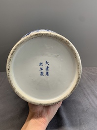 Two Chinese blue and white 'prunus on cracked ice' vases and covers, Kangxi mark, 19th C.