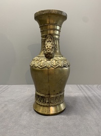 A Chinese bronze vase with lion-form handles, 17/18th C.