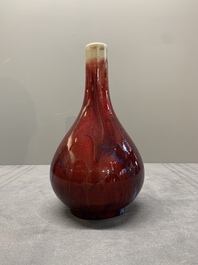 A Chinese black-glazed 'tianqiu ping' vase and a flamb&eacute;-glazed bottle vase, 19/20th C.