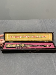 Two Chinese Canton gilt-lacquered and painted paper fans, one with original box, 19th C.