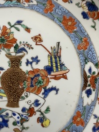 A Chinese famille rose 'antiquities' dish and two plates, Yongzheng/Qianlong