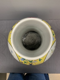 A large Chinese famille rose yellow-ground 'tianqiu ping' vase with flowers and antiquities, 19th C.
