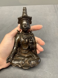 A Vietnamese bronze deity on a lotus throne, 18/19th C.