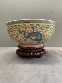 A Chinese famille rose turquoise-and-yellow-ground 'dragon' bowl on wooden stand, Qianlong mark, Republic