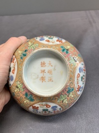 A pair of Chinese famille rose pink-ground 'antiquities' bowls, Zhengde mark, 19th C.