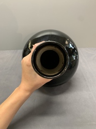 A Chinese black-glazed 'tianqiu ping' vase and a flamb&eacute;-glazed bottle vase, 19/20th C.