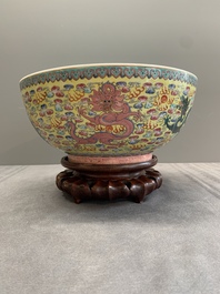 A Chinese famille rose turquoise-and-yellow-ground 'dragon' bowl on wooden stand, Qianlong mark, Republic