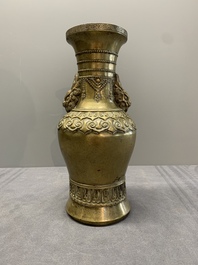 A Chinese bronze vase with lion-form handles, 17/18th C.