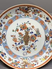 A Chinese famille rose 'antiquities' dish and two plates, Yongzheng/Qianlong