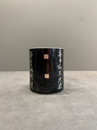 A Chinese black-glazed reverse-decorated 'poem' brush pot, 19th C.